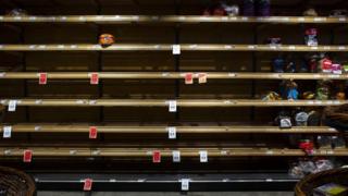 An almost-empty grocery shelf