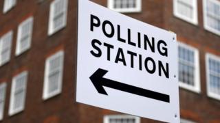 Sign directing people to a polling station in London