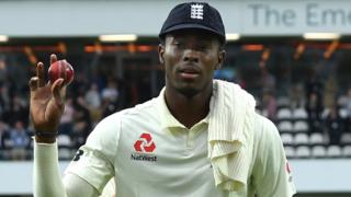 England fast bowler Jofra Archer holds up the ball to the crowd as he walks off after taking 6-45 against Australia