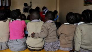 Pupils, some of them orphans sit during a lesson at a Nyanyo Project's preschool in Kibera, one of Africa's largest slums on 29 November 2010