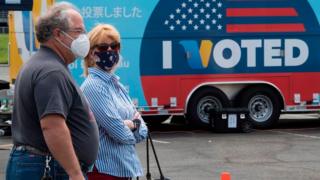 Voters in masks