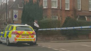 Police car and officer on Vincent Road