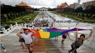 Members of the LGBT community join a march to celebrate the pride month at the National Chiang Kai-shek Memorial Hall in Taipei, Taiwan, 28 June 2020