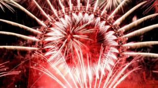 Fireworks explode around the London Eye