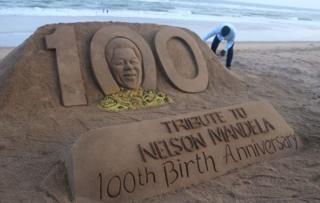 Sand sculpture of former president of South Africa Nelson Mandela is seen at the Bay of Bengal Sea's eastern coast beach as it is creating by Indian sand artist Sudarshan Pattnaik for visitors attraction on the occasion of his 100th birth anniversary at Puri, 65 km away from the eastern Indian state odisha's capital city Bhubaneswar, on July 18, 2018.