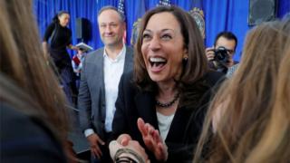 US Senator Kamala Harris, with her husband Douglas Emhoff at her side, greets primary voters in April 23, 2019