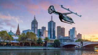 Изображение летающего такси Uber на фоне горизонта Мельбурна