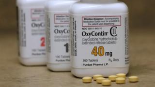OxyContin Prescription Analgesic Pill Bottles, manufactured by Purdue Pharma LP, are placed on a counter at a pharmacy in Provo, Utah.