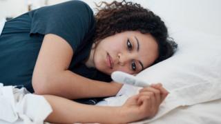 Mujer con fiebre