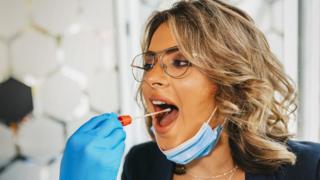 Woman being swab-tested