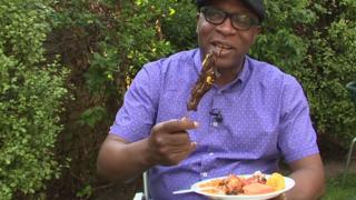 Peter Okwoche eating Nigerian food in London