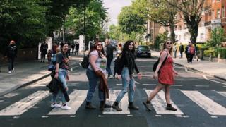From left to right: Natalie Culmone, Natalie Worsley, Kyra Scarlett, and Grace Gasparini on the Abbey Road crossing