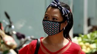 Woman wears protective mask in Bangalore, India