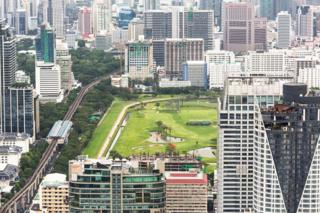 The golf course right in the heart of Bangkok city with the BTS (skytrain) line on its left. Bangkok is Thailand capital city.