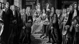 The Articles of the Union of the Parliaments of England and Scotland are presented to Queen Anne at court by the Duke of Queensberry on behalf of Scotland, 1707