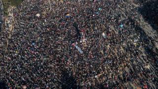 An aerial view of people demonstrating against the government of Chilean President Sebastian Pinera, in Santiago on 12 November, 2019.