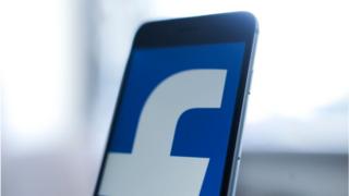 Facebook logo on a smartphone