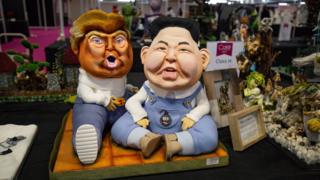 A cake depicting US President Donald Trump and North Korea leader Kim Jong-un on display during Cake International 2019 at the NEC, Birmingham