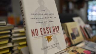Copies of a book by former Navy SEAL titled No Easy Day are seen on display at a bookstore in Washington, DC