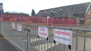 Signs to say the site is closed have been placed on the school gates