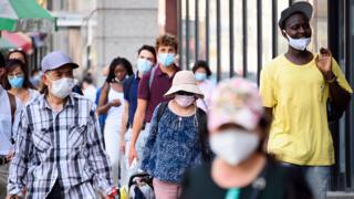 People wearing masks in Chinatown, New York City