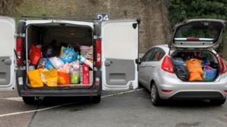 van and car full of bags