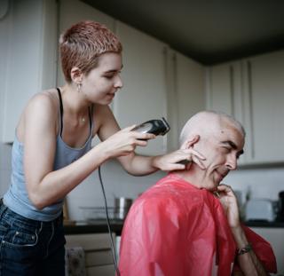 Molly shaves her dad's head