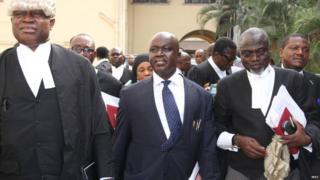 Rickey Tarfa (centre) with some of his team