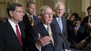 Senate Majority Leader Republican Mitch McConnell (C) , Republican Senator from Wyoming John Barrasso (L), Republican Senator from South Dakota John Thune (Back) and Republican Senator from Texas John Cornyn (R) speak to members of the news media.