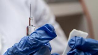 File photo - a nurse gives a free flu vaccine at a mobile flu vaccination centre in Russia