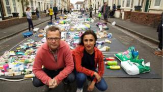 Hugh-Fearnley-Whittingstall-and-Anita-Rani-on-a-street-with-plastic-on-the-road.