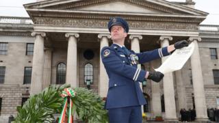 Irish Air Corps' Captain Sean McCarthy reads the Irish proclamation