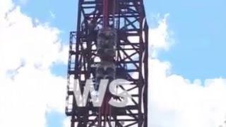 Passengers trapped on the BuzzSaw rollercoaster ride at Dreamworld