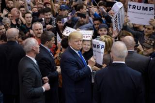 Donald Trump signs autographs during a rally at the International Exposition Center March 12, 2016 in Cleveland, Ohio
