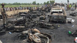 The scene of the fire near the Pakistani city of Ahmedpur East, 25 June