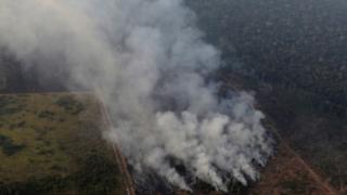 Smoke billows during a fire in an area of the Amazon rainforest near Porto Velho, Rondonia State, Brazil.