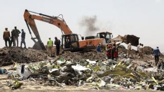 A power shovel digs at the crash site of Ethiopia Airlines near Bishoftu, a town some 60 kilometres southeast of Addis Ababa.