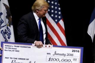 Trump presents a cheque