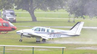 An aeroplane carrying trainer Richard Hannon spins out of control on landing during 32Red Sprint Cup Day at Haydock Park