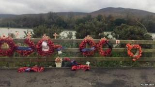   Wreaths at the site of the narrow water 