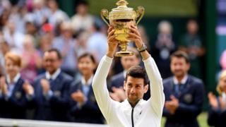 Novak Djokovic celebrates winning the Wimbledon men's singles title
