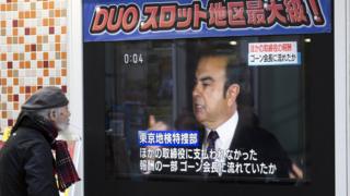 A man watches a monitor showing an image of Nissan Motor Co. Chairman Carlos Ghosn in a news program on November 20, 2018 in Tokyo, Japan