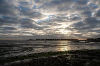 Winter sun over water