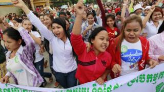 Cambodian garment workers shout slogans during a gathering at a garment factory in Phnom Penh, Cambodia, 07 October 2015