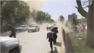 People flee the site of the bombings