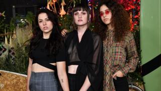 Meet Muna: The 'queer pop' band who caught Harry Styles's eye - BBC News