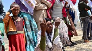 Grieving families at the crash site