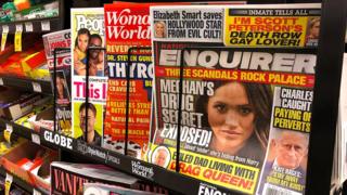 Newstand with National Enquirer closest to camera