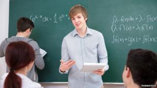 Students writing equations