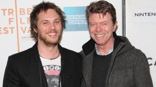 Duncan Jones and his father David Bowie at a film premier in 2009